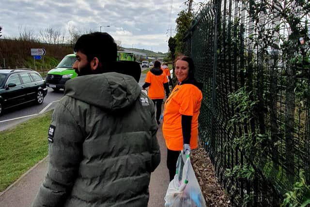 Amazon workers out picking up litter during Earth Month