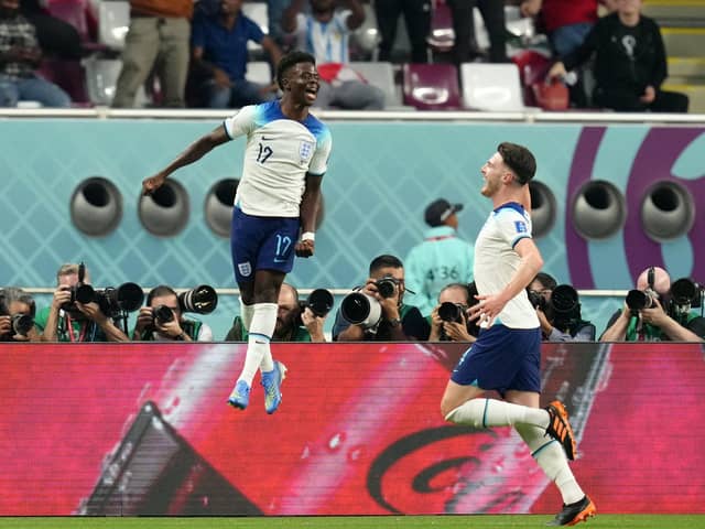 I'LL SECOND THAT: England's Bukayo Saka celebrates scoring the second goal against Group B rivals Iran with Declan Rice (right) at the Khalifa International Stadium. Picture: Nick Potts/PA