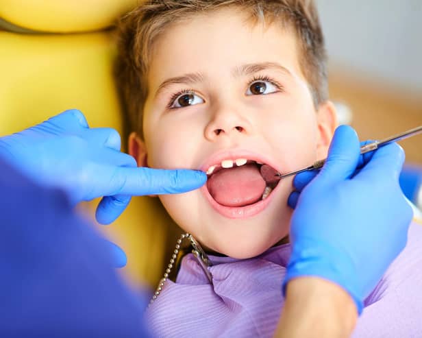 A dentist checking a child's teeth. Picture: Adobe stock