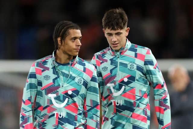 Jayden Luker in discussion with fellow Luton youngster Joe Johnson - pic: Warren Little/Getty Images