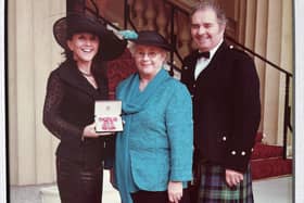 Linda Barr MBE at Buckingham Palace with her proud parents