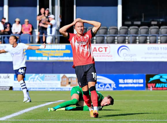 Cauley Woodrow reacts after missing Luton's best chance on Saturday