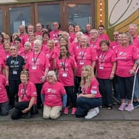 Distinctive pink T-shirts used as volunteer uniform at festival set to be auctioned in aid of charity