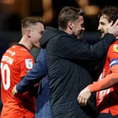 Rob Edwards celebrates Luton's 3-0 win at QPR with defender Tom Lockyer
