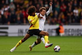 Luke Freeman tries to win the ball back from Watford's Hamza Choudhury this afternoon