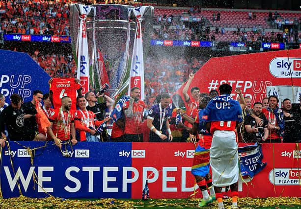 Luton celebrate winning promotion at Wembley
