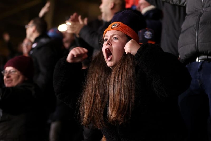 A Luton Town fan celebrates their side's second goal during the Sky Bet Championship match between Luton Town and Middlesbrough at Kenilworth Road on November 02, 2021.