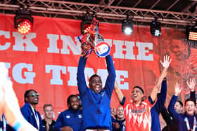 Marvelous Nakamba with the Championship play-off winners' trophy
