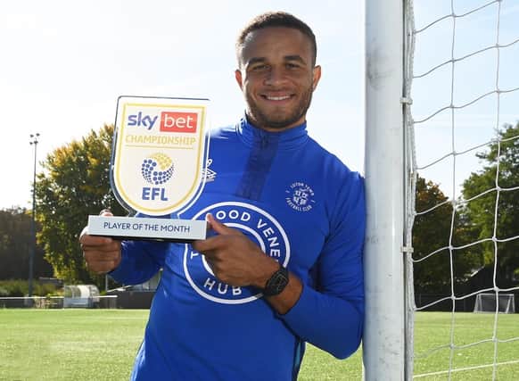 Carlton Morris with his Championship Player of the Month award