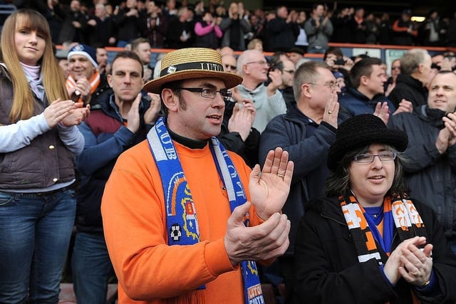 A Luton Town supporter wears a straw hat as he enjoys the atmosphere before the FA Cup with Budweiser Fifth Round Match between Luton Town and Millwall FC at Kenilworth Road on February 16, 2013.