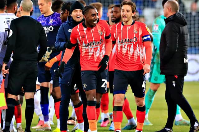 Luton's players celebrate beating Stoke City 1-0
