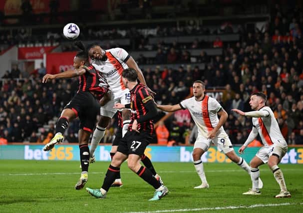 Teden Mengi gets a header away during Luton's 4-3 defeat to AFC Bournemouth - pic: Mike Hewitt/Getty Images