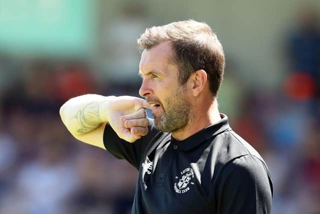 Hatters boss Nathan Jones watches on during Luton's victory at Northampton on Saturday