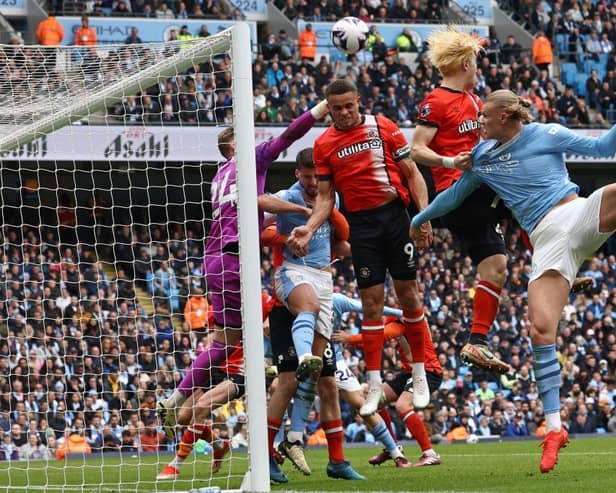 Thomas Kaminski punches the ball clear against Manchester City - pic: DARREN STAPLES/AFP via Getty Images
