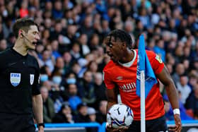 Town defender Amari'i Bell speaks to the linesman during Monday night's defeat to Huddersfield