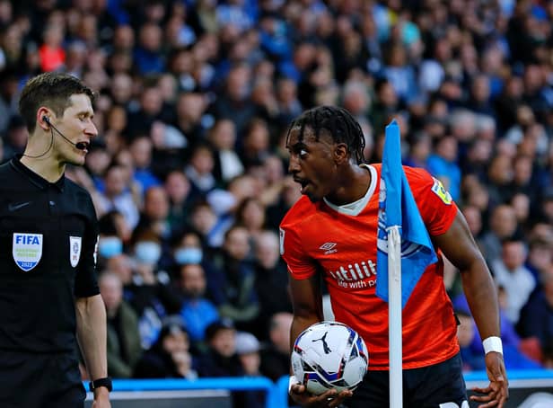 Town defender Amari'i Bell speaks to the linesman during Monday night's defeat to Huddersfield