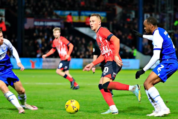 Cauley Woodrow in action during Luton's 1-1 draw with Wigan on Saturday