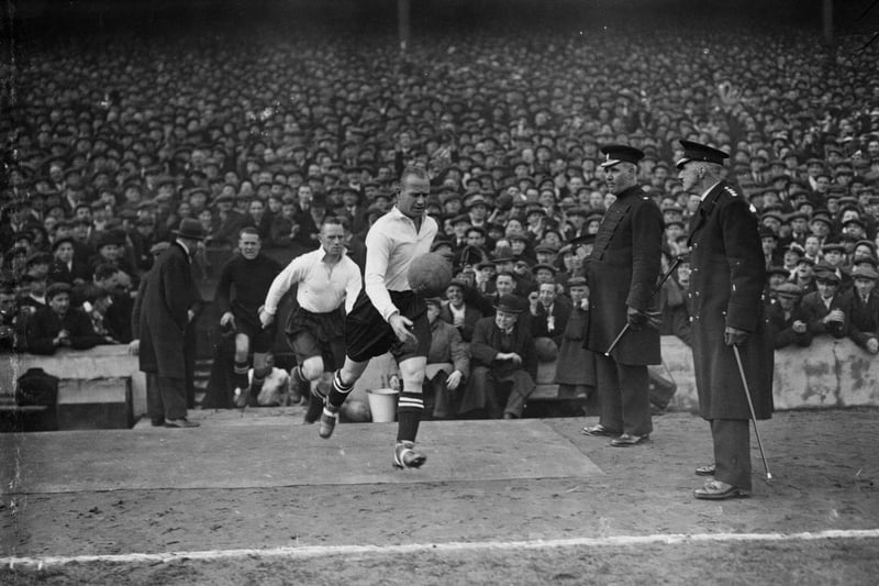 Luton Town captain Mike Keen, leads his team out onto the pitch on 11th March 1933 against Cardiff City. It ended in a 3-2 defeat for Luton in the Division Three (South) fixture.