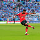 Cody Drameh sends over a cross for Luton during their play-off final win over Coventry City last season - pic: Liam Smith