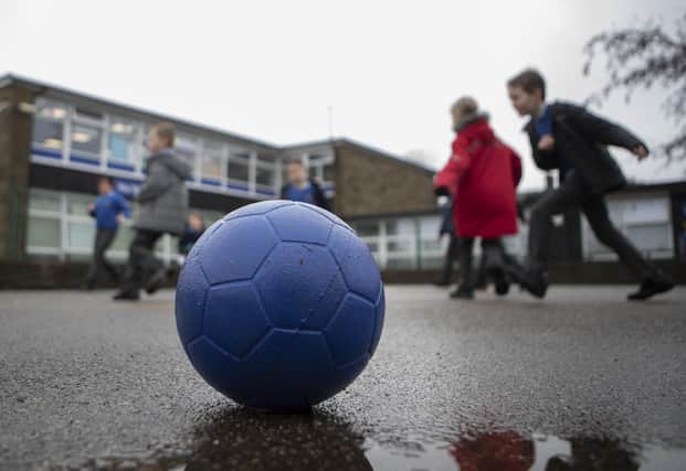 Schoolchildren playing. Photo from Danny Lawson/ PA Images