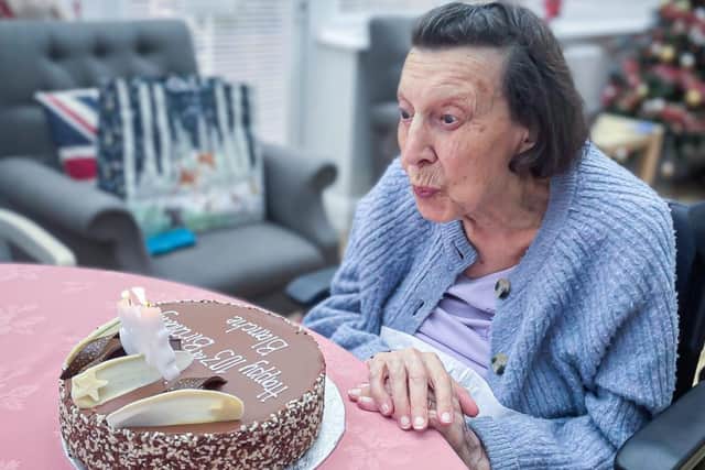Blanche Blowing Out Her Candles On Her 103rd Birthday Cake