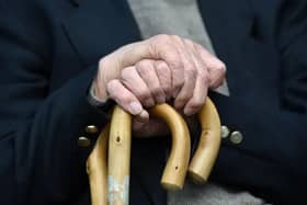 An elderly man holding a walking stick. Picture: Joe Giddens/PA