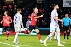 Cauley Woodrow wheels away after scoring his first ever Luton goal on Boxing Day
