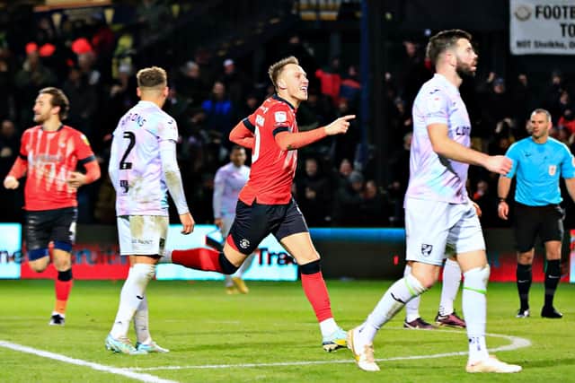 Cauley Woodrow wheels away after scoring his first ever Luton goal on Boxing Day