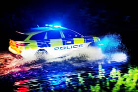 Police car was seen driving through water in Luton. Picture: Tony Margiocchi