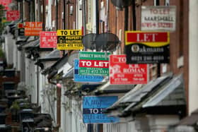 An array of To Let and For Sale signs protrude from houses. (Photo: Christopher Furlong via Getty Images)