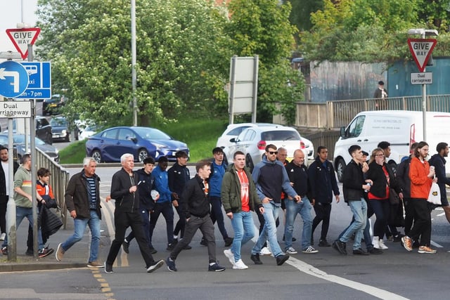 A stream of fans heading to the match