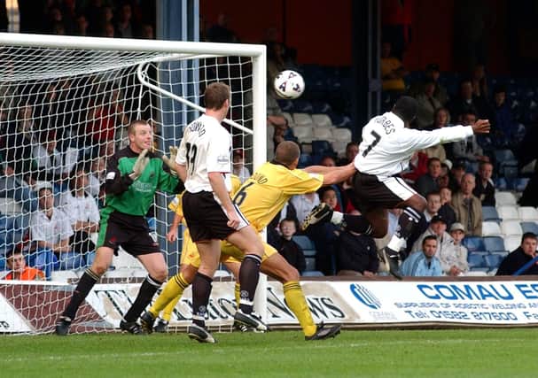 Adrian Forbes gets up to head home Luton's third back in 2001