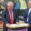 Labour's John Tizard signs the oath after winning the Police and Crime Commissioner role