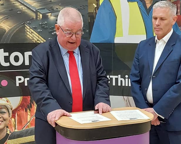 Labour's John Tizard signs the oath after winning the Police and Crime Commissioner role
