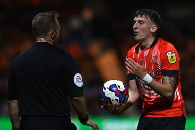 Alfie Doughty pleads his case to the officials during Luton's 0-0 draw with Reading on Tuesday night
