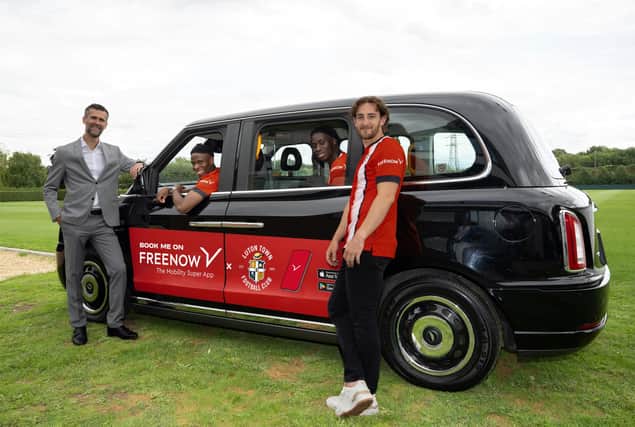 Luton Town players pose in a special taxi cab. (Picture: FREENOW)