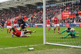 Cauley Woodrow scores the rebound after his penalty was saved at Rotherham on Saturday - pic: Gareth Owen