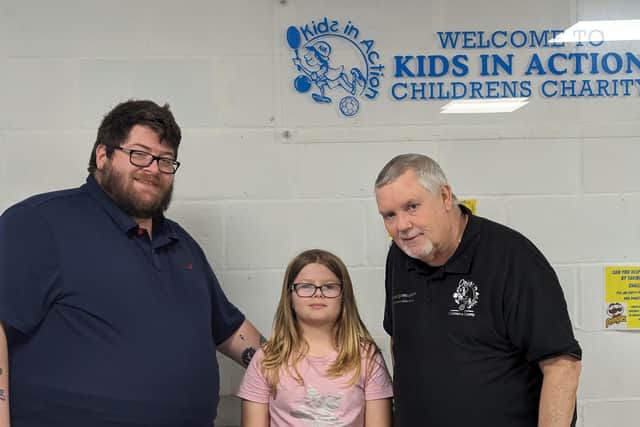 Carl Taylor with his daughter Eleanor and Paul Bowen-James from Kids in Action.