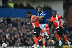 Teden Mengi gets to the ball ahead of Everton striker Beto during Luton's 2-1 FA Cup win on Saturday - pic: PAUL ELLIS/AFP via Getty Images