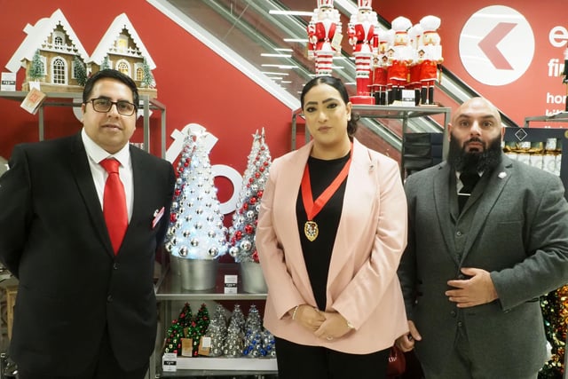Store manager Amjid Hussain poses with Cllr Raja and her consort.