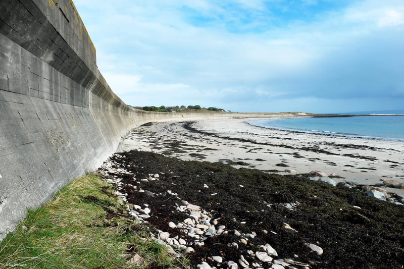 This is Longis beach, the wall was built by slave labour to prevent an amphibious attack.