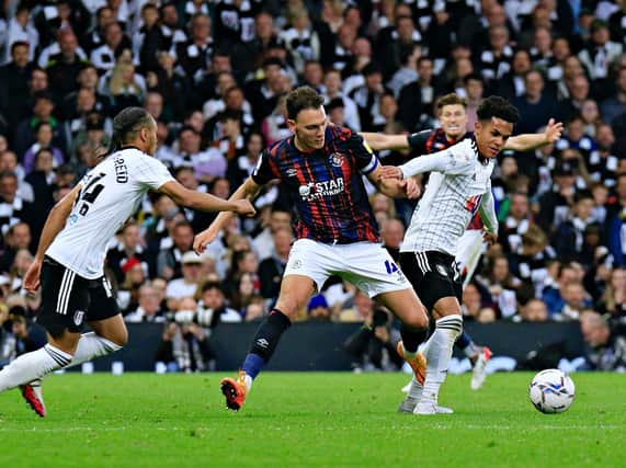 Town defender Kal Naismith in action at Fulham