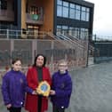 Thornhill Primary head boy and girl with Lindsey Davenport of Bellway, the company that kindly donated the defibrillator which has been installed at the school for the local community