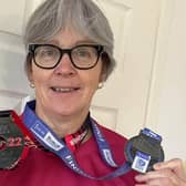Kate Neale with her marathon medals