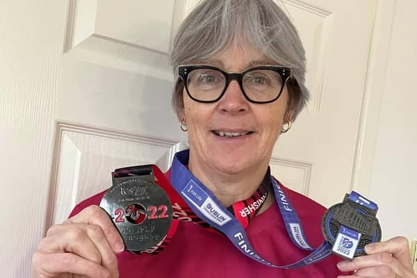 Kate Neale with her marathon medals