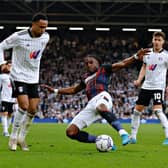 Amari'i Bell slides in to try and win the ball back against Fulham