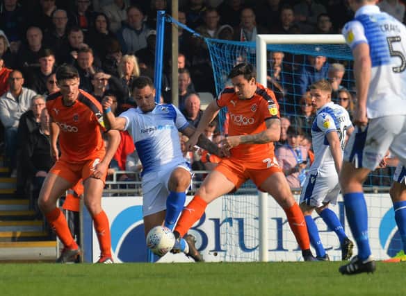Midfielder George Thorne looks to win the ball against Bristol Rovers during his loan stint with the Hatters