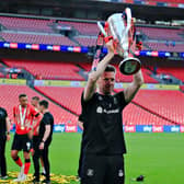 Luton boss Rob Edwards lifts the Championship play-off winners' trophy