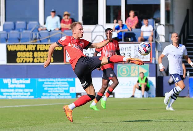 Town attacker Cauley Woodrow is available to face Millwall this weekend