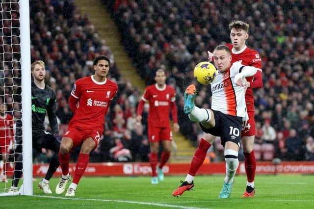 Cauley Woodrow keeps the ball in against Liverpool - pic: Clive Brunskill/Getty Images